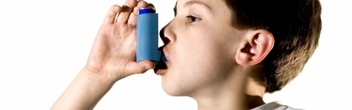 boy using inhaler