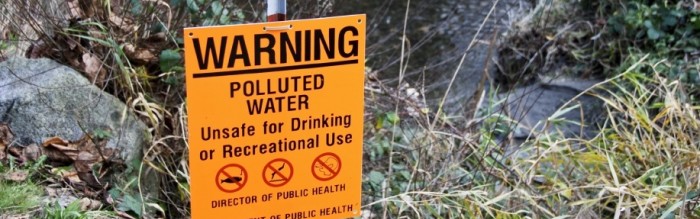 polluted stream warning sign